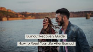 Smiling couple walking by the water and laughing together outdoors, with the text “Burnout Recovery Guide: How to Reset Your Life After Burnout” displayed across the image.