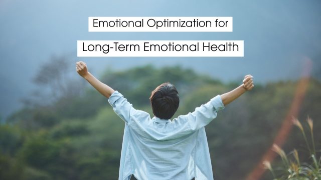 Person standing outdoors with arms raised in a gesture of strength and relief, symbolizing emotional optimization, resilience, inner balance, and long-term emotional health.