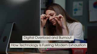 Tired office worker rubbing her eyes while holding her glasses in front of a computer screen, with the text “Digital Overload and Burnout: How Technology Is Fueling Modern Exhaustion” displayed across the image.