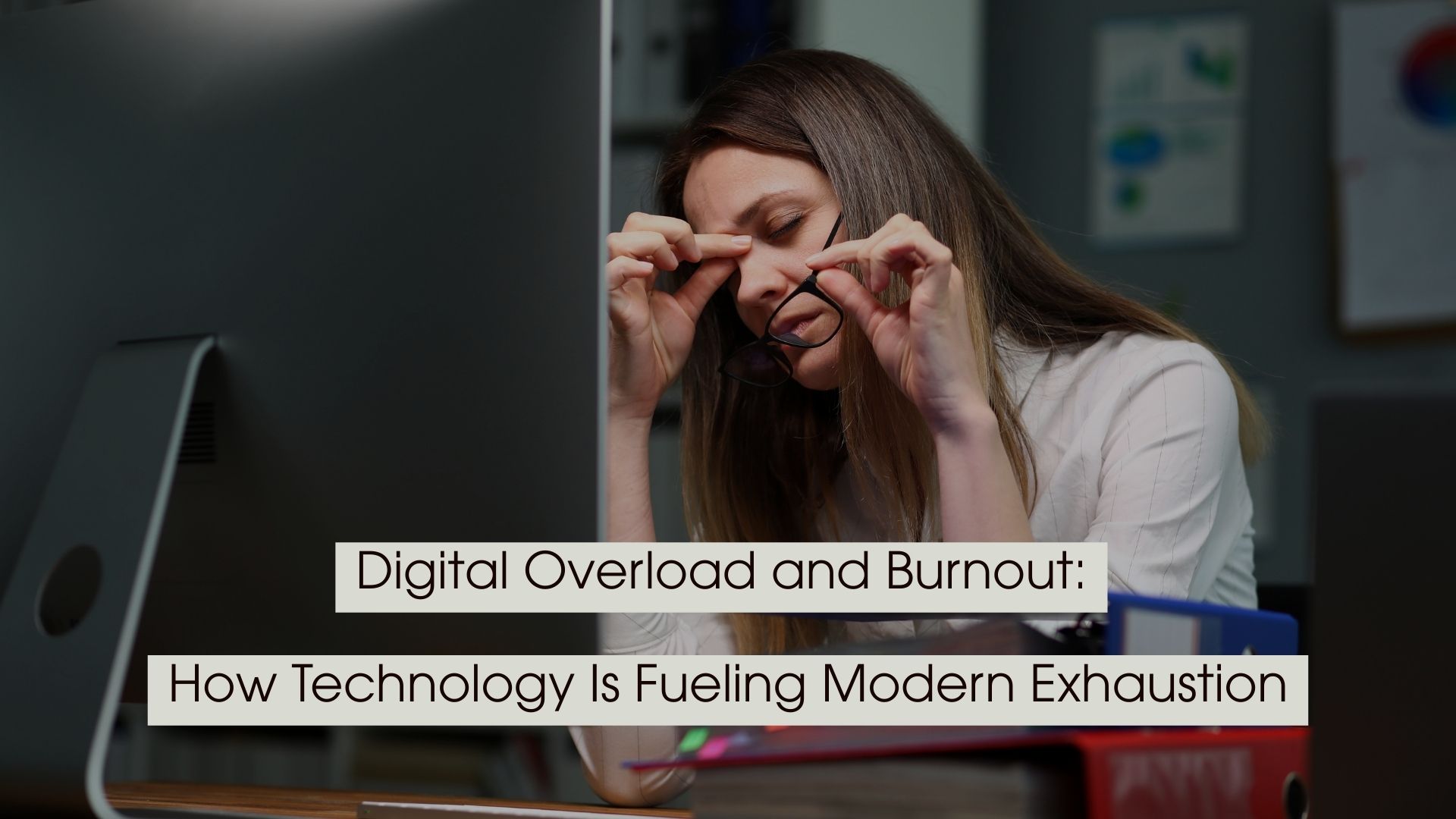Tired office worker rubbing her eyes while holding her glasses in front of a computer screen, with the text “Digital Overload and Burnout: How Technology Is Fueling Modern Exhaustion” displayed across the image.