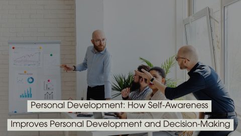 Team meeting with a presenter pointing at charts on a board while colleagues engage in discussion, with the text “Personal Development: How Self-Awareness Improves Personal Development and Decision-Making” displayed across the image.