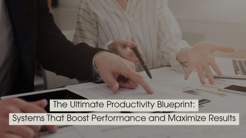 Two professionals reviewing documents and pointing at charts on a desk, representing planning and performance optimization, with the text “The Ultimate Productivity Blueprint: Systems That Boost Performance and Maximize Results” displayed across the image.