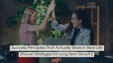 Two women celebrating with a high-five in a workspace with a laptop, representing achievement and collaboration, with the text “Success Principles That Actually Work in Real Life (Proven Strategies for Long-Term Growth)” displayed across the image.