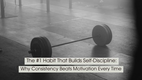 A black-and-white photo of a loaded barbell resting on the floor of an empty gym symbolizes discipline, consistency, and the quiet commitment required to achieve long-term goals. The minimalist, moody atmosphere emphasizes showing up and putting in the work even when motivation fades. Overlaid text reads: “The #1 Habit That Builds Self-Discipline: Why Consistency Beats Motivation Every Time.”