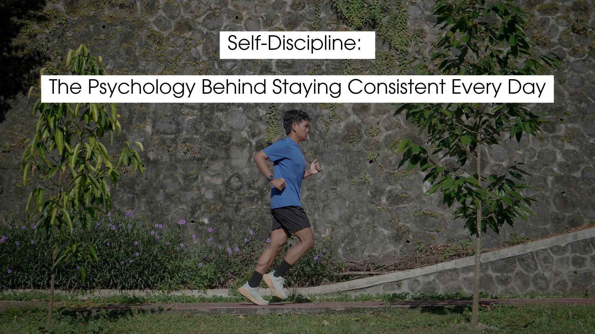 Self discipline illustrated by a man jogging outdoors along a stone wall and greenery, symbolizing consistency, focus, and daily habits, with an overlay headline reading “Self-Discipline: The Psychology Behind Staying Consistent Every Day.”