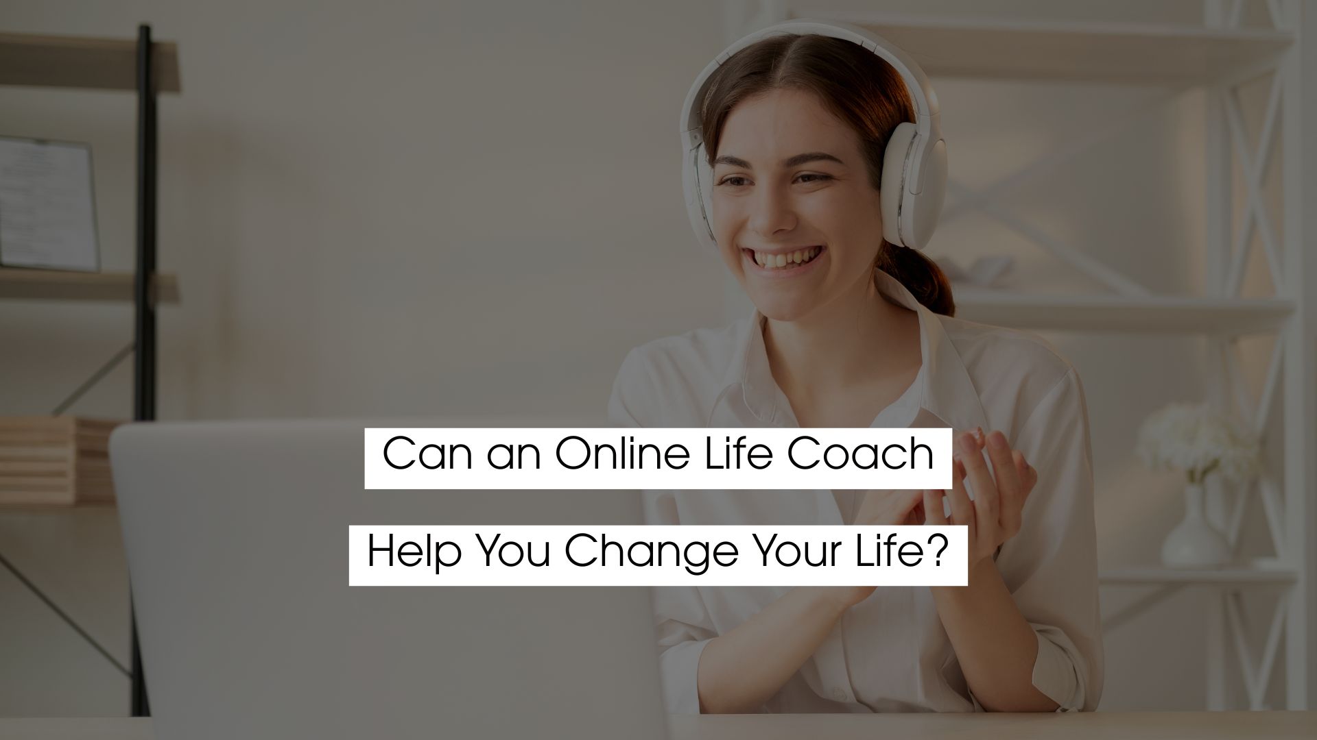 Smiling woman wearing headphones attending an online life coaching session on a laptop, illustrating how an online life coach helps support personal growth and life change.