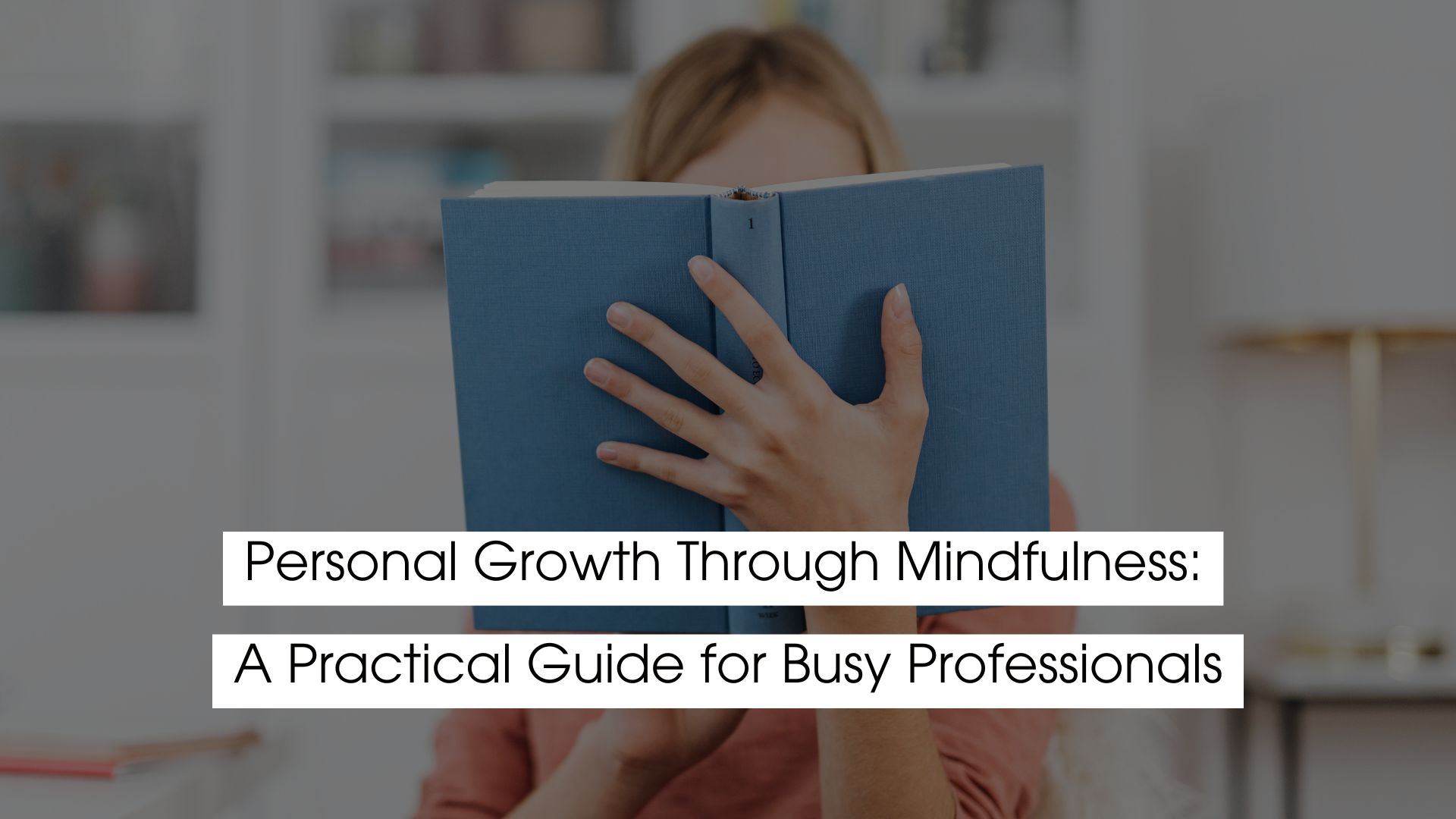 A professional practicing mindfulness by reading a book, representing personal growth, self-awareness, and stress management for busy professionals.