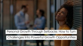 A woman standing indoors looking upward thoughtfully, representing personal growth through setbacks and turning challenges into powerful opportunities for self-improvement.