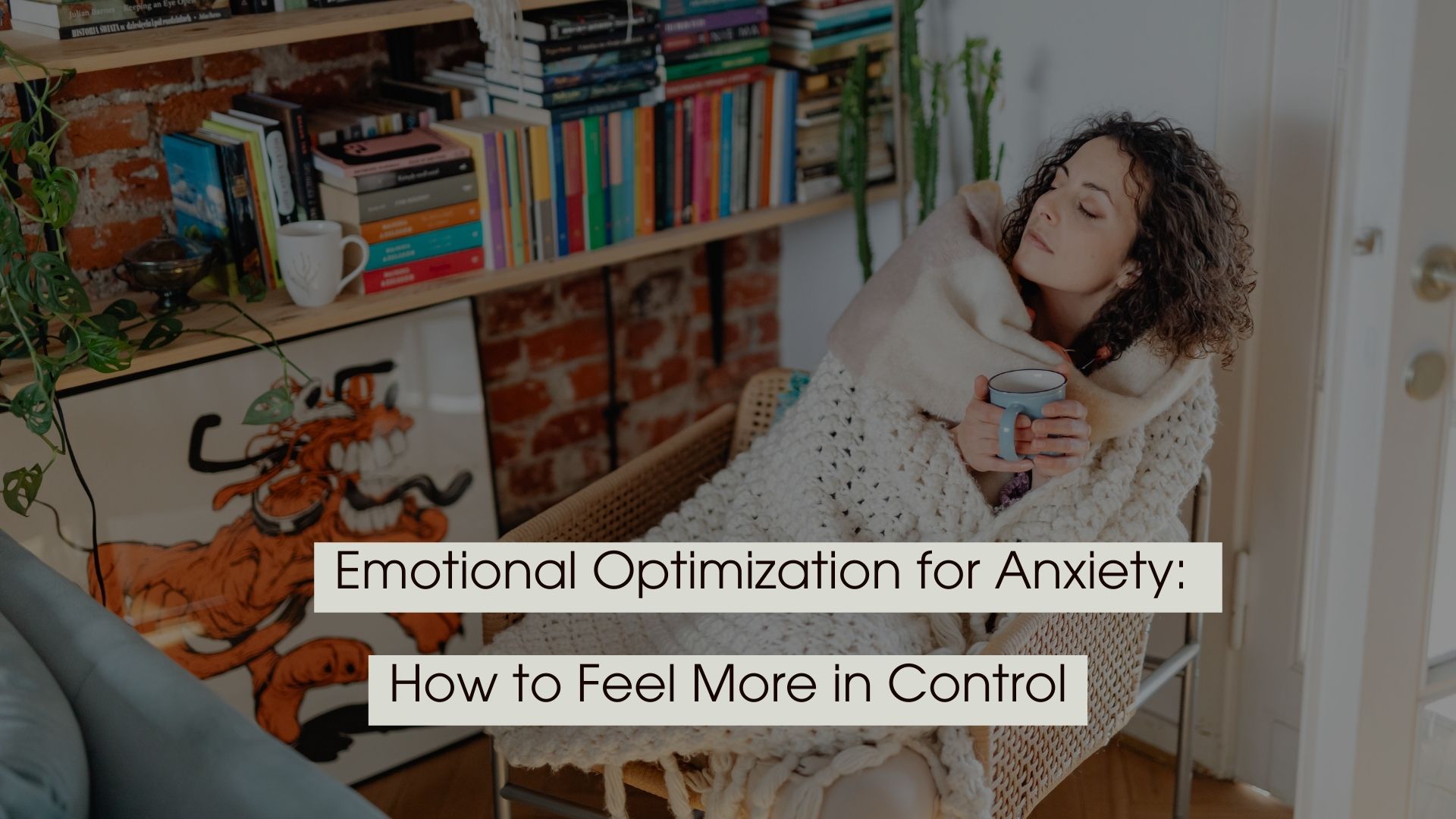 Woman wrapped in a cozy blanket holding a mug at home, representing emotional optimization for anxiety and feeling more in control.