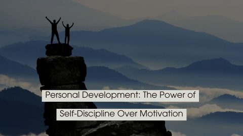 Silhouettes of two people standing triumphantly on top of a tall rock formation overlooking layered mountain ranges, with the text “Personal Development: The Power of Self-Discipline Over Motivation” displayed across the image.